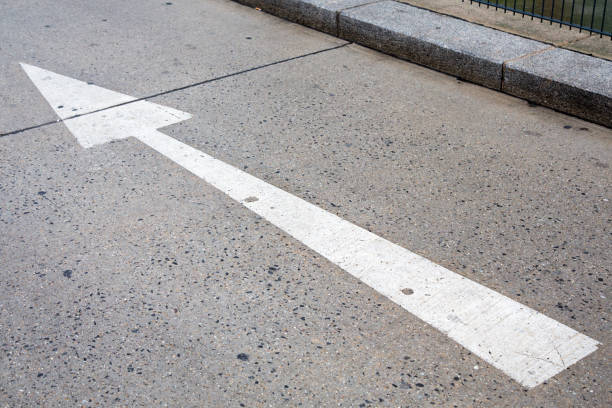 istock one way paint sign on road 994172598