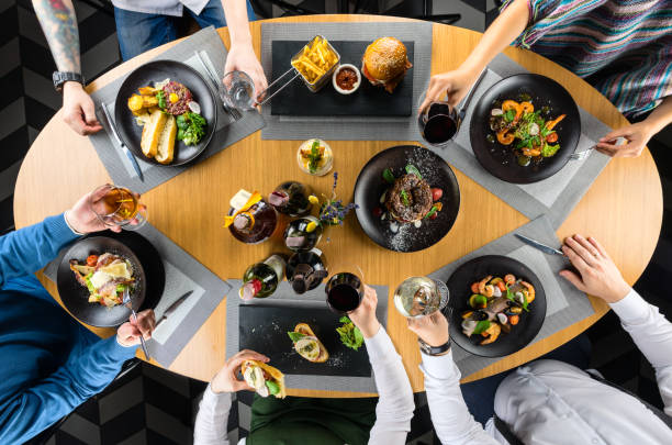 istock Unidentified friends having dinner in restaurant 994173178