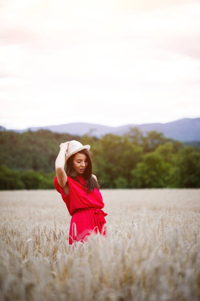 istock Beautiful girl in a wheat field 994175408