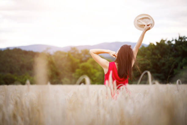 istock Beautiful girl in a wheat field 994176306