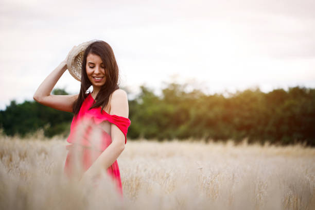 istock Beautiful girl in a wheat field 994176678
