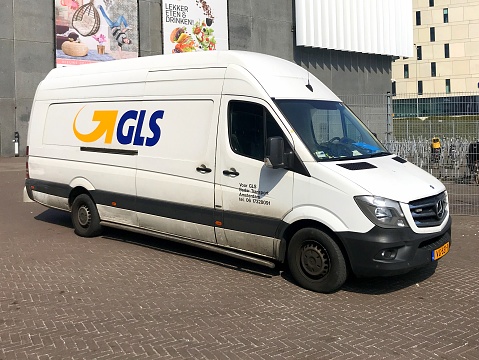 Amsterdam, the Netherlands - July 6, 2018: GLS Parcel Service van parked by the side of the road. No people inside the vehicle.