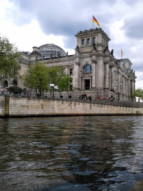 istock Reichstag with reflection in Spree, Berlin 994186050