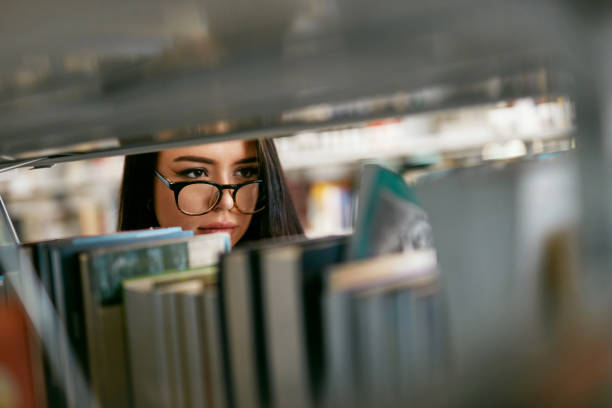 istock Student Woman Searching Books In Bookstore Or Library 994193428