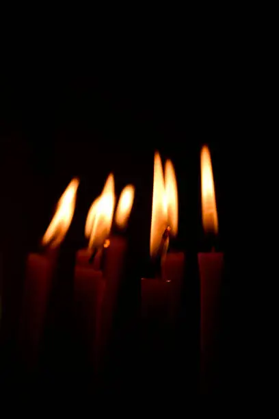 Photo of Few candles burning in the dark