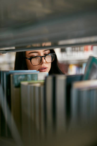 istock Student Woman Searching Books In Bookstore Or Library 994193486