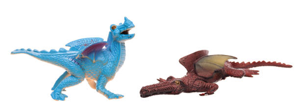Toy dragons on white isolated background