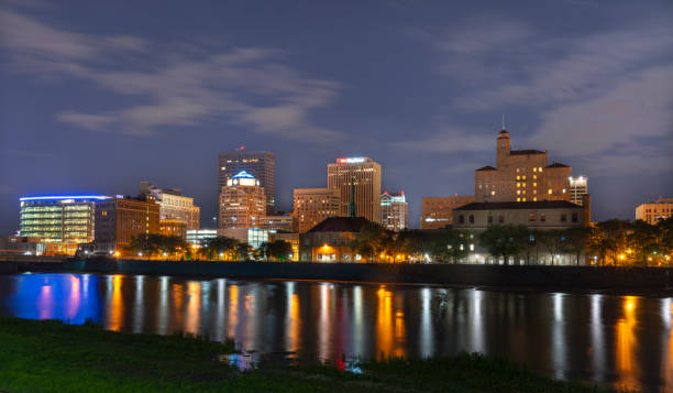 Dayton Ohio Downtown at Night The Downtown Area of Dayton Ohio as seen from the bike trails along the Great Miami River. dayton ohio skyline stock pictures, royalty-free photos & images