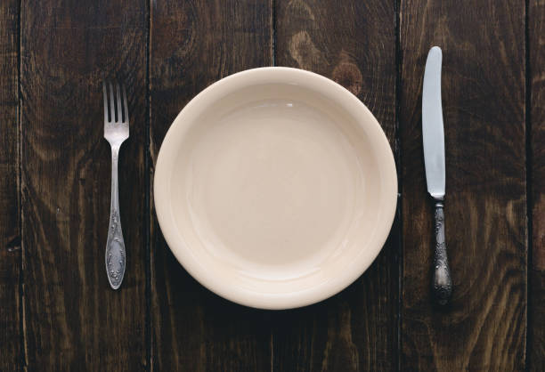 istock cutlery on wooden table 994210746