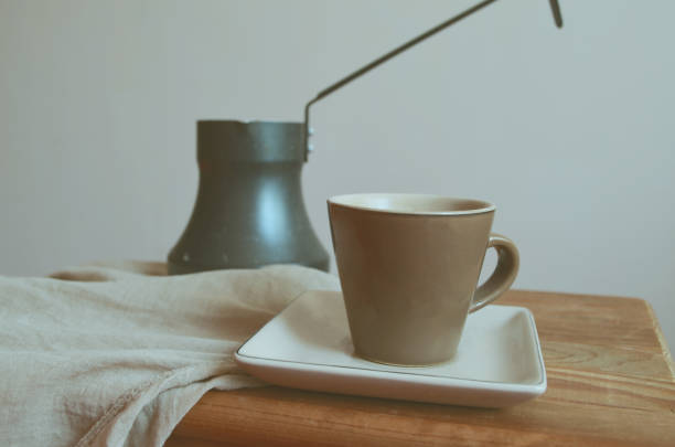 istock Cup of coffee and Turk on wooden table. Rustic style 994211680