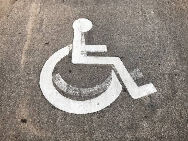istock parking sign for disabled on gray asphalt 994218440