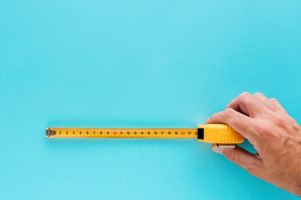 istock Handyman measuring size with tape meter 994234190