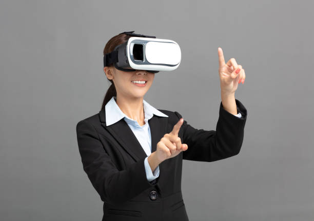 istock young business Woman with virtual reality goggles 994243718