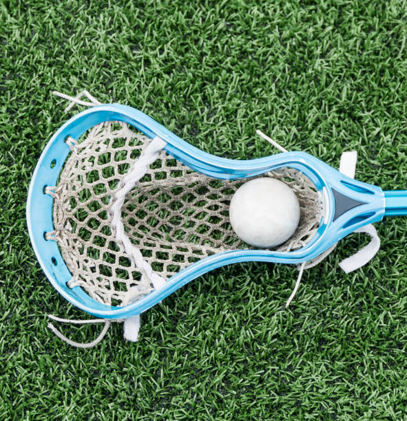 istock Carolina blue lacrosse stick with a white ball 994255386