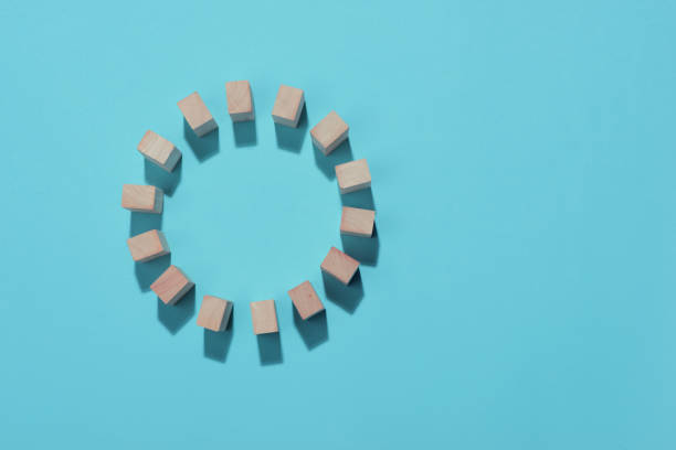 istock Wooden block in circle on blue background. 994259170