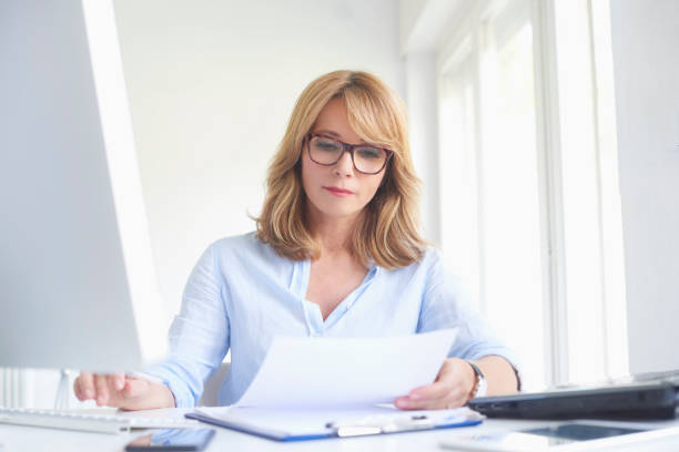istock Attractive businesswoman working on computer at the office 994259602