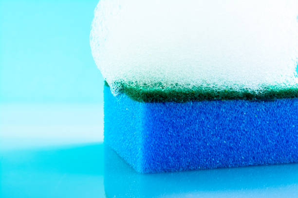 istock Sponge with foam and bubbles, close-up, texture, light blue background. 994259794