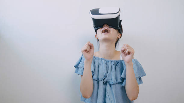 istock asian woman using the virtual reality headset 994263282