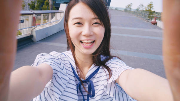 young woman smile take selfie