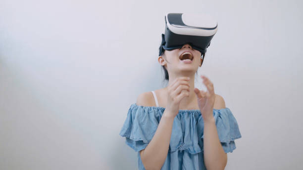 istock asian woman using the virtual reality headset 994263324