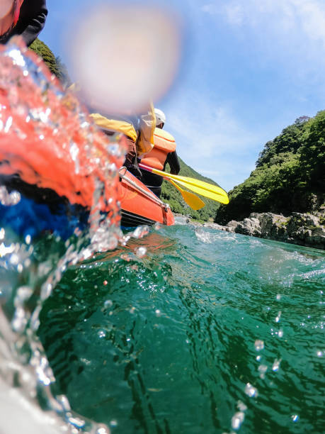 istock Low angle view of a white water river rafting excursion 994263692
