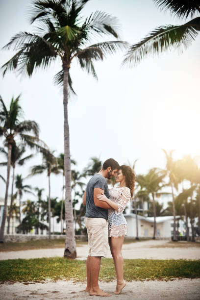 Shot of a young couple spending a romantic day at the beach