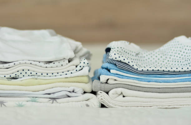 istock Folded clothes for a newborn boy 994269958