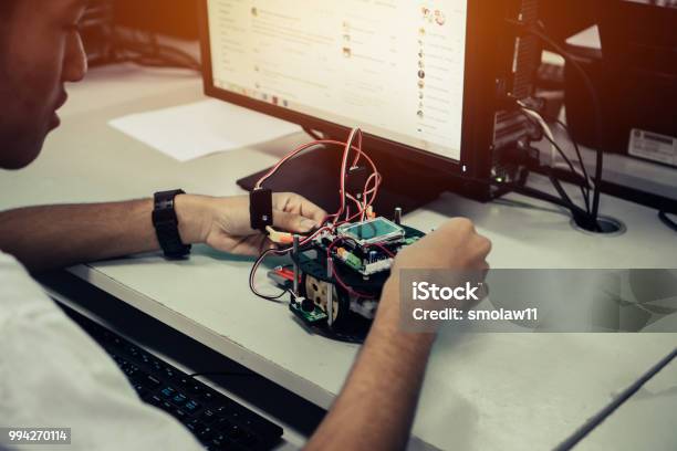 Asian Student Thinking And Learning Stem Education Robotics For Creating Project Based Studying For Innovation Robot Model Study Generation For Diy Electronic Kit In Computer Teachnology Classroom Stock Photo - Download Image Now