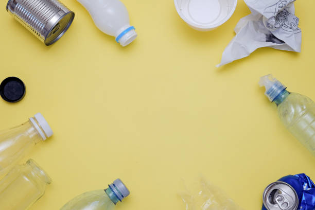 istock Eco concept with recycling symbol and garbage on table background top view 994274144