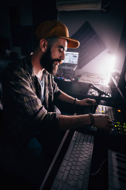 istock Hipster radio station DJ and presenter broadcasting music from studio 994277954