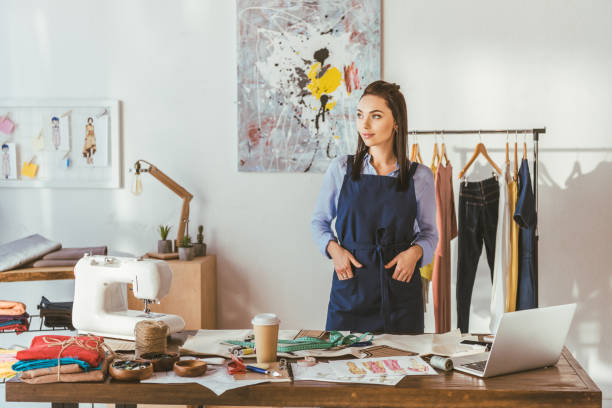 istock young seamstress standing at working place and looking away 994285162