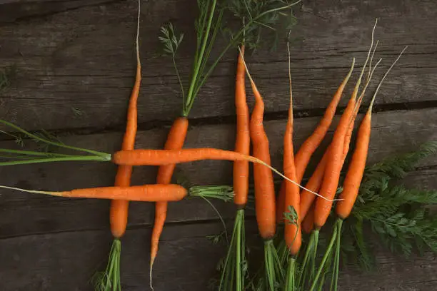 Photo of Hash tag shaped from fresh carrots.