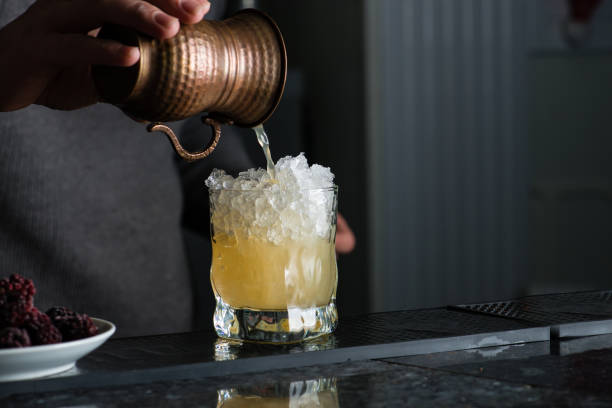 istock bartender in a nightclub pouring cocktail 994285462