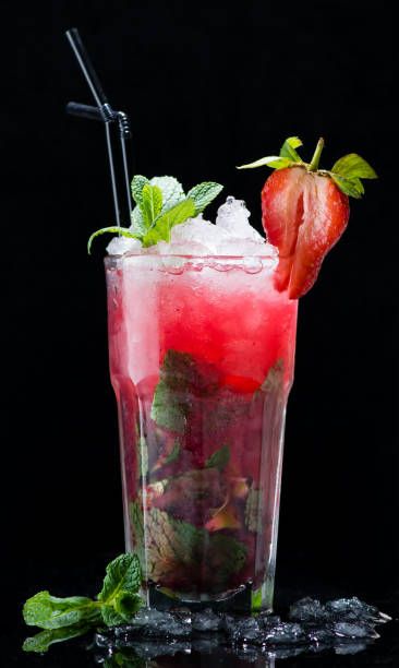 istock Cocktail strawberry mojito on a dark background 994288716