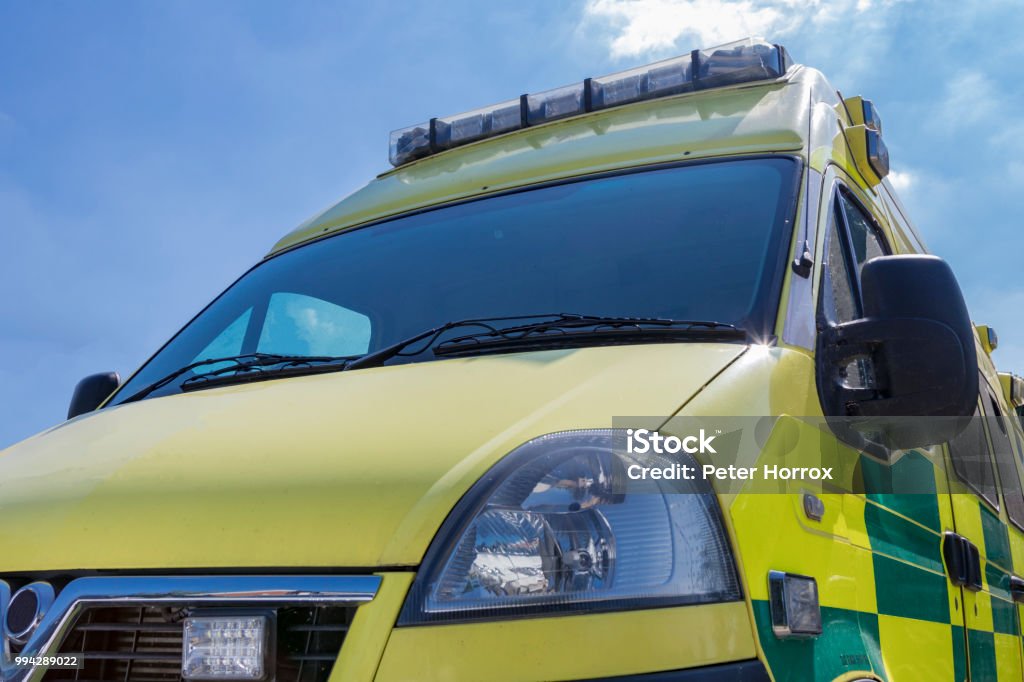 Yellow and green British Ambulance on a sunny day Ambulance Stock Photo