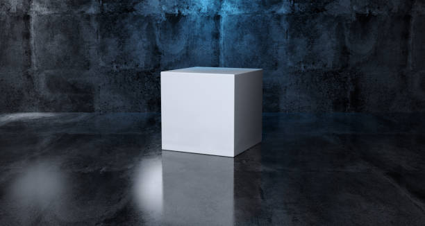 istock Abstract Geometric Simple Primitive Shape White Cube In Realistic Dark Concrete Room Texture With Blue Light 3D Rendering 994289076