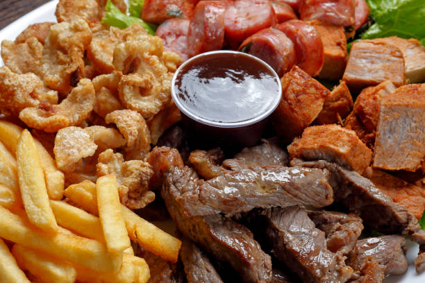istock Snacks with fries, crackers, meat, pork, sausage and babercue sauce 994297616