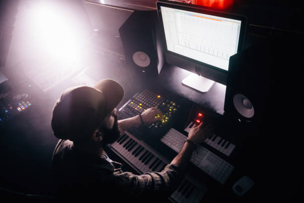 istock DJ working on professional audio equipment and producing music 994297718