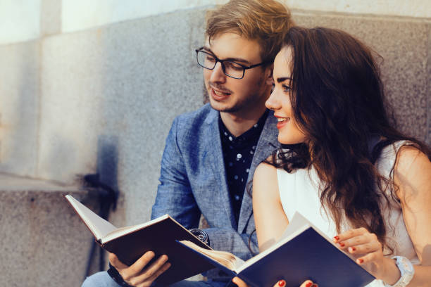 istock Happy couple reading books 994303074