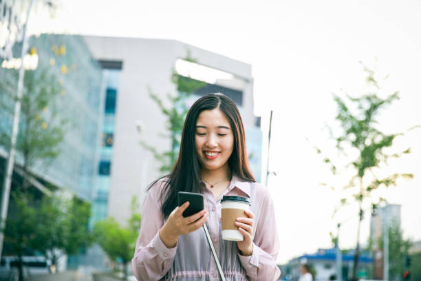 istock Street time with phone and coffee 994303570