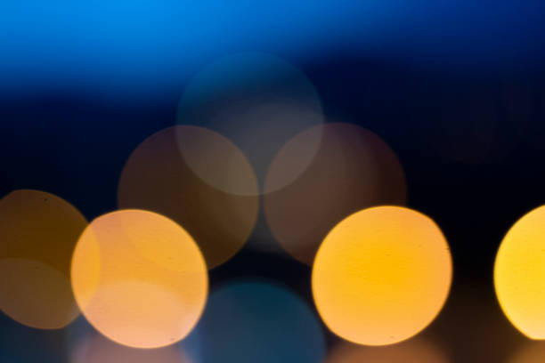 istock Golden bokeh on black background 994315076