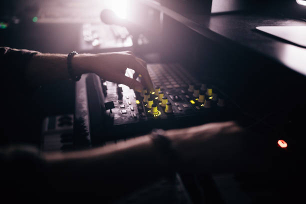istock Close-up of radio station DJ working on audio control panel 994318278
