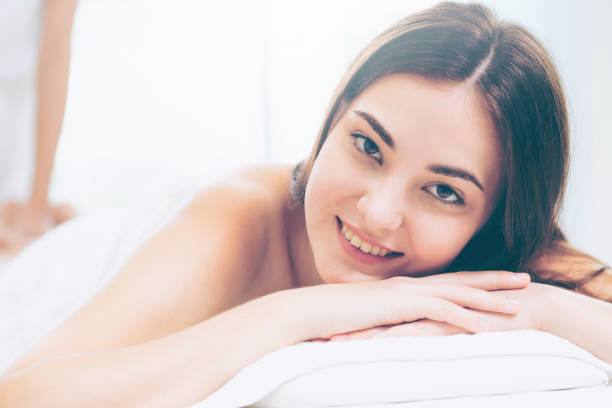 istock Woman gets back massage spa by massage therapist. 994318910