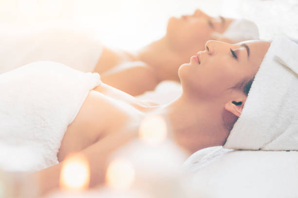 istock Relaxed young woman lying on spa bed for massage. 994319056