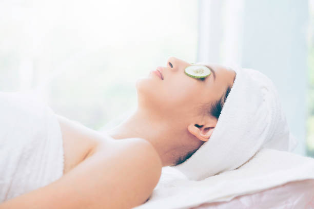 istock Woman getting eye nature treatment by cucumber. 994319128