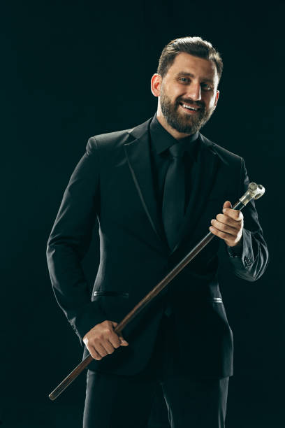 istock The barded man in a suit holding cane 994319412