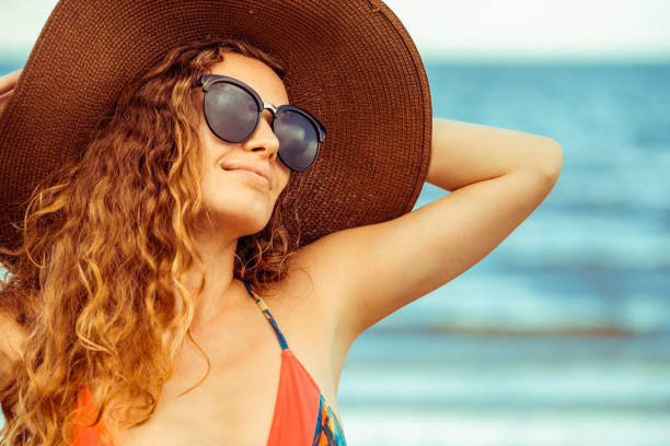 istock Happy young woman at beach in summer vacation. 994324924