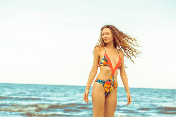 istock Happy young woman at beach in summer vacation. 994326780