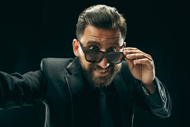 istock The barded man in a suit at black studio 994327376