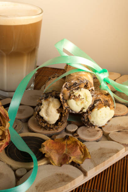 cannoli sweets with rose decoration